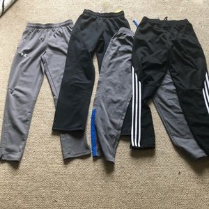Bundle of four boys athletic pants, size M and L